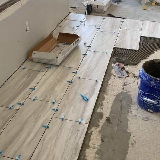 Large format floor tile set with spacers