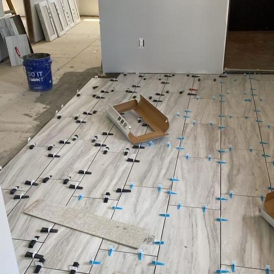 Large format floor tile dry laid to check the layout