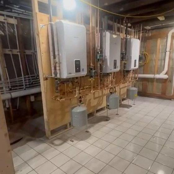 Commercial mechanical room with wall hung boilers and copper distribution