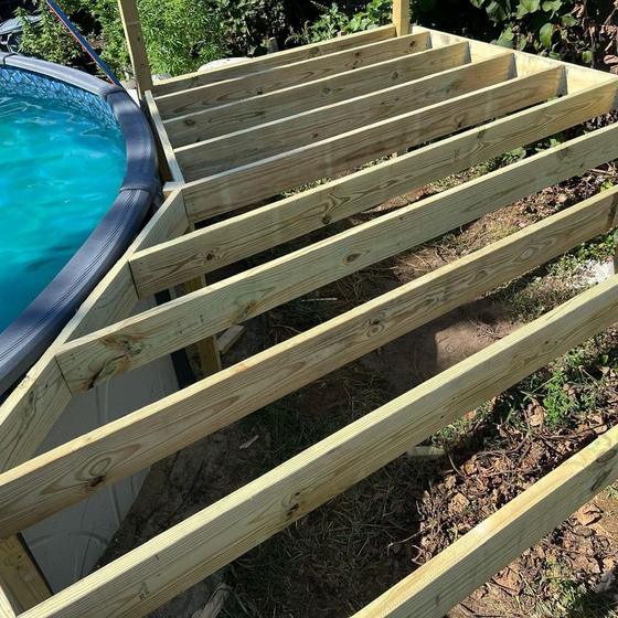 pressure treated frame built around an above ground pool