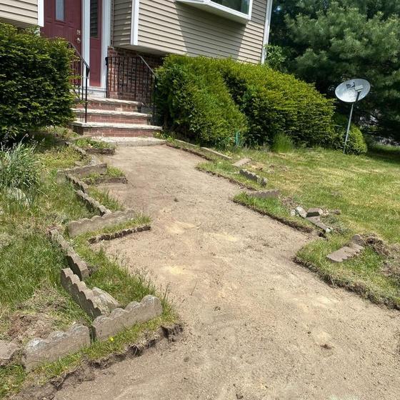 Old walkway stripped out and the base graded