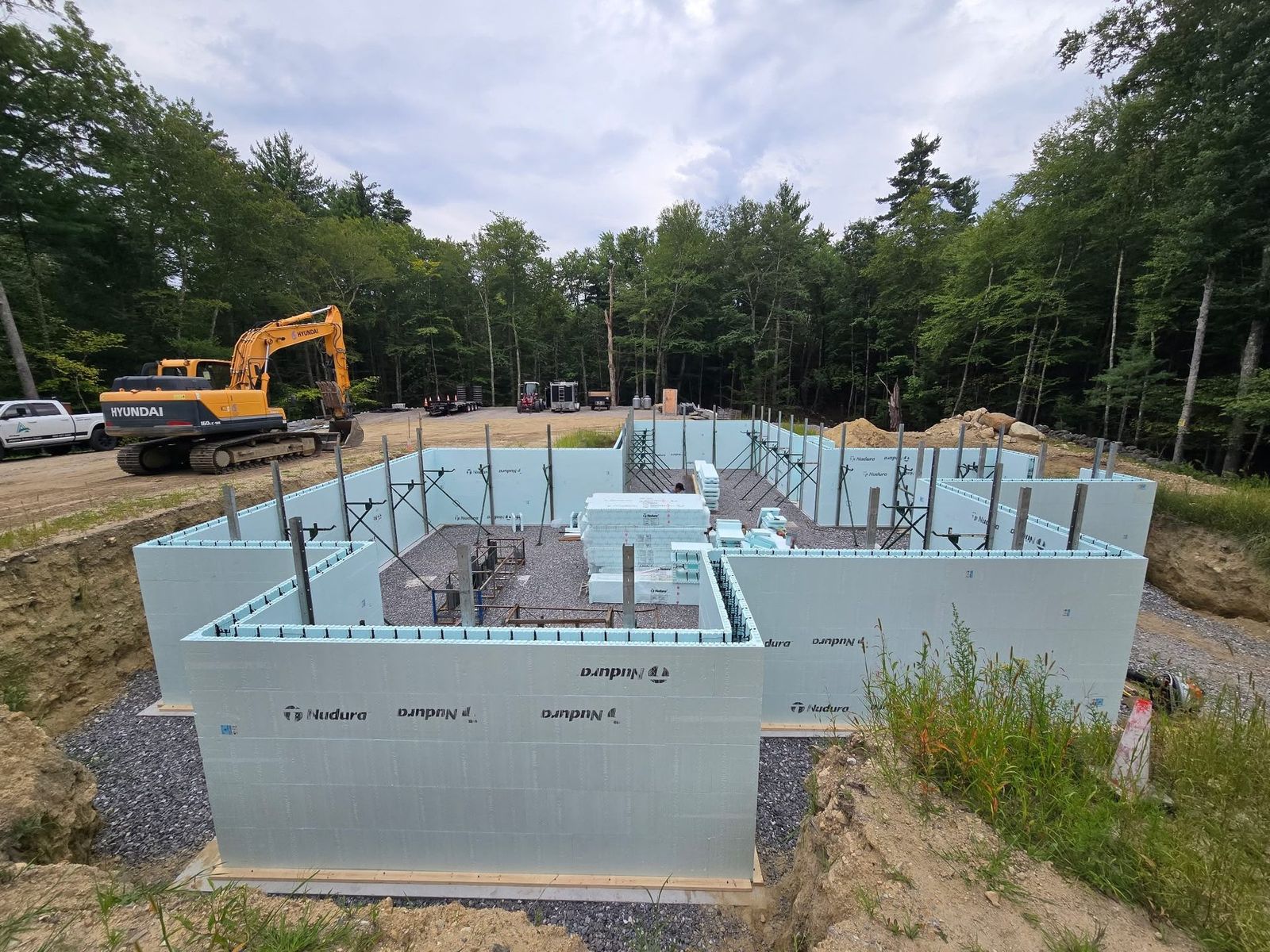 Vertical reinforcing and alignment bracing installed on the stacked forms, ready for the concrete pour