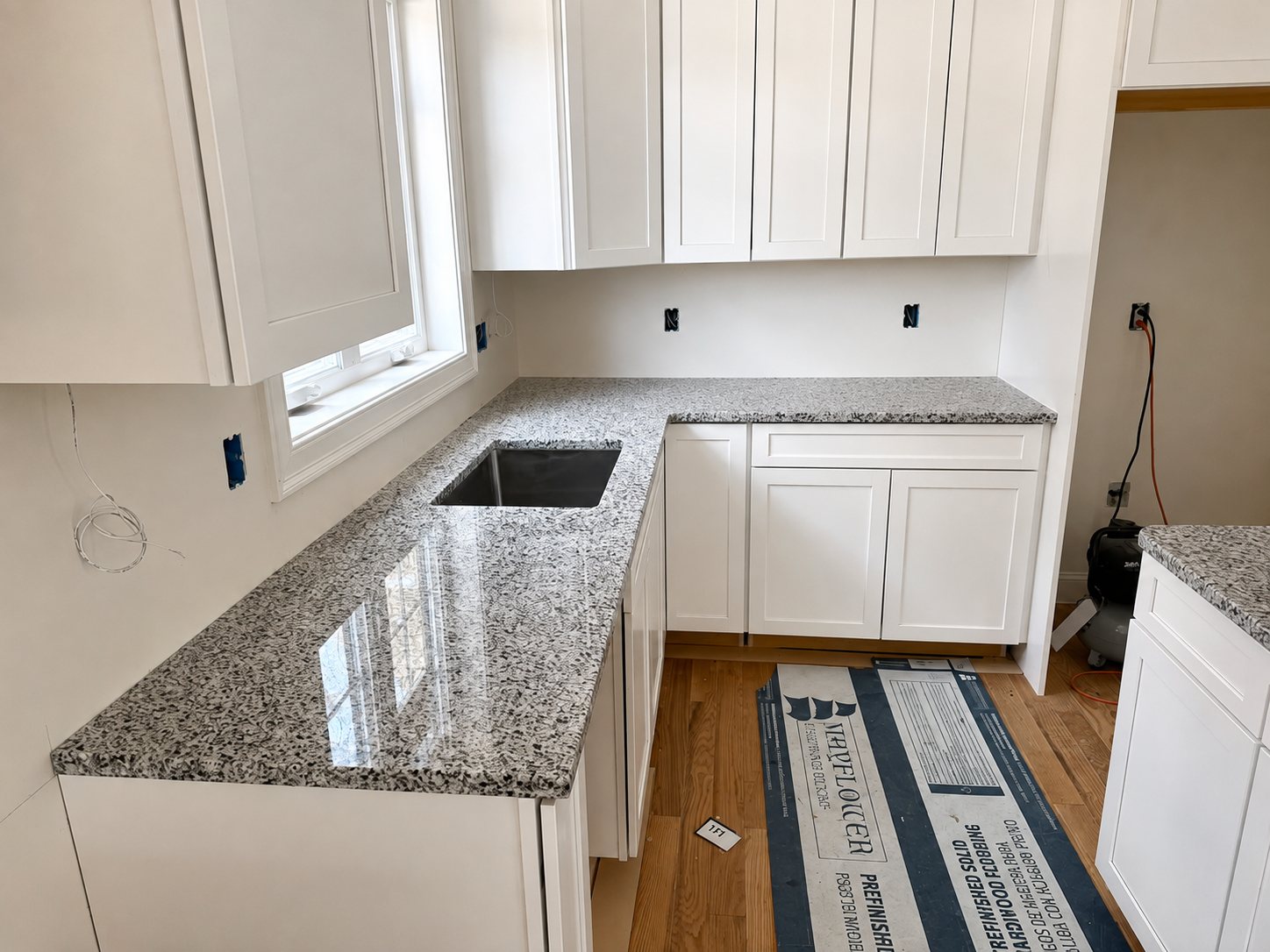 finish carpentry and trim in a white kitchen